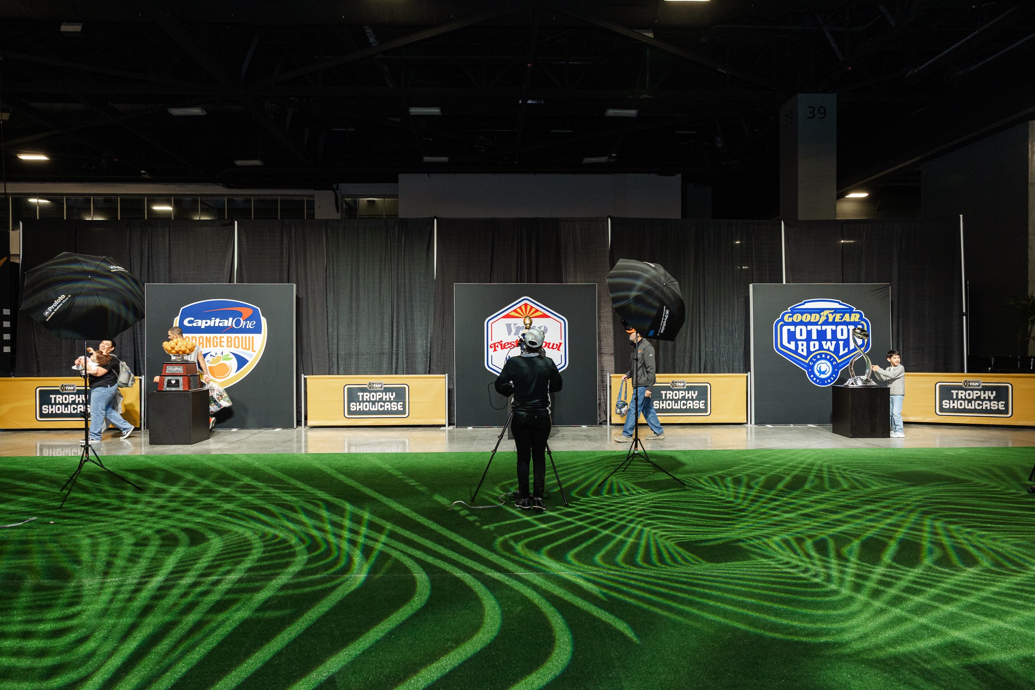 Multiple professional photo stations for the College Football Playoff trophy experience