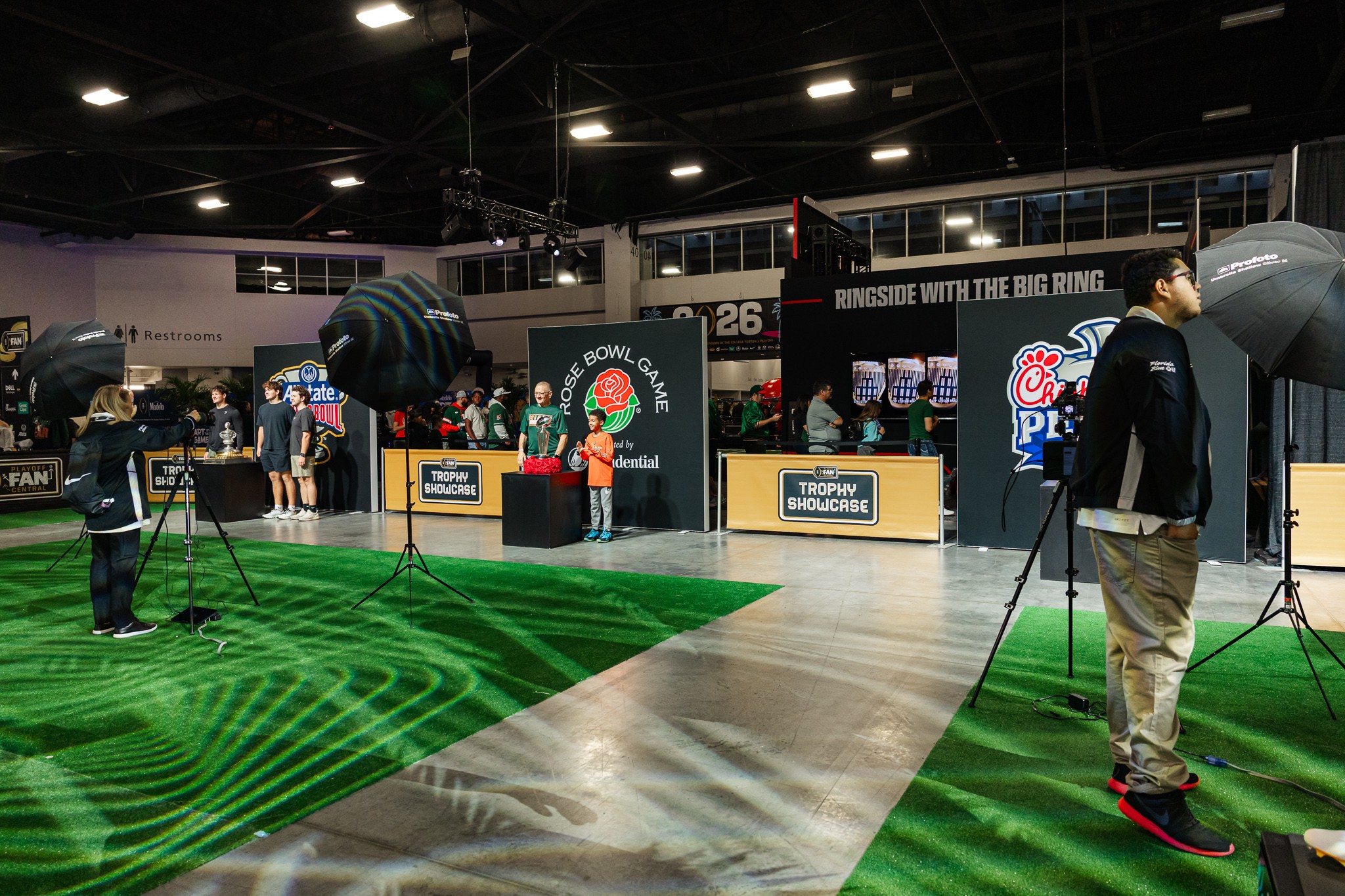 Multiple trophy photography stations operating at College Football Playoff Fan Central
