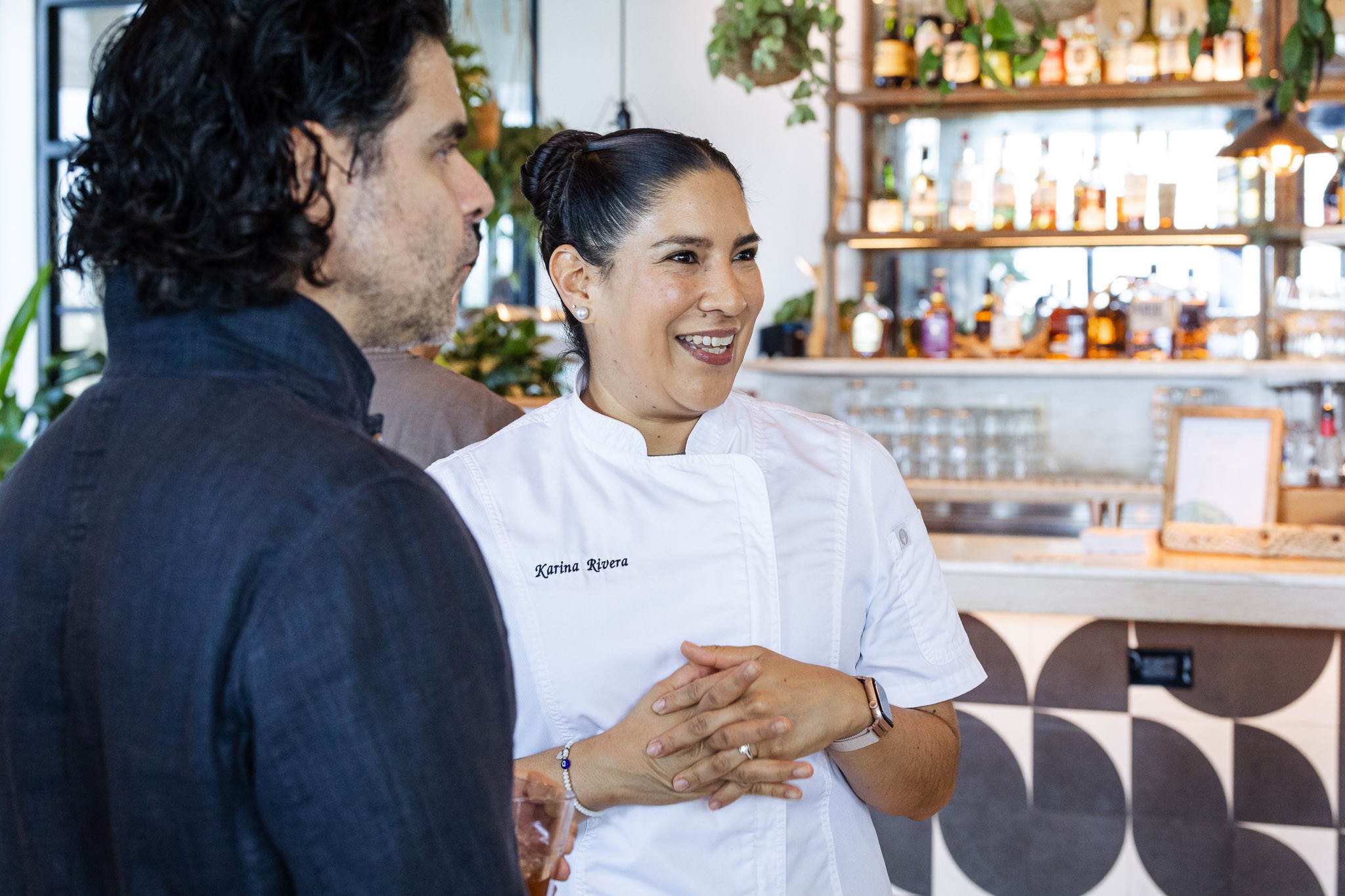 Chef Karina Rivera speaking with guests at a Callebaut event in Miami