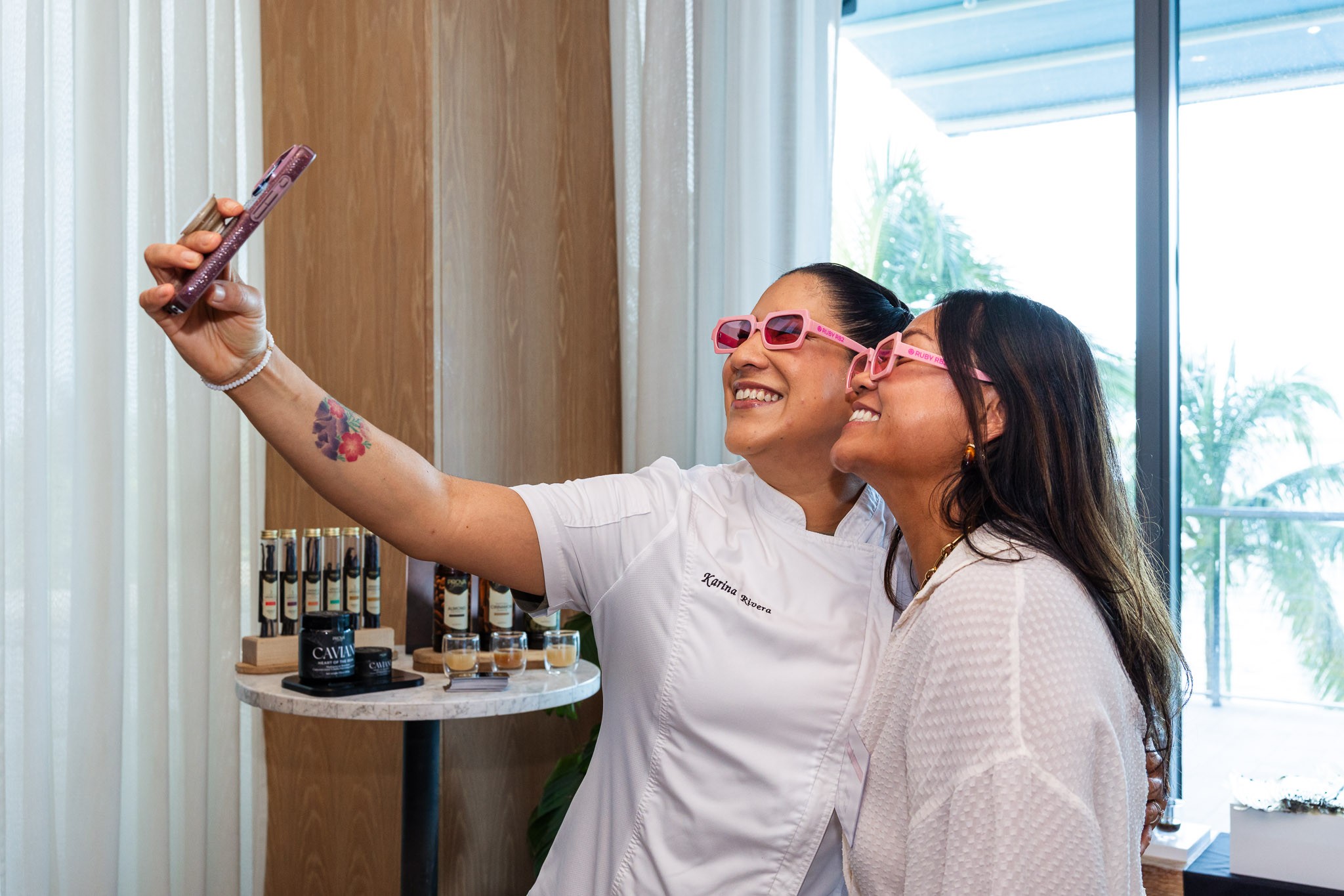 Chef Karina Rivera taking a selfie with a guest during Callebaut Masters of Taste