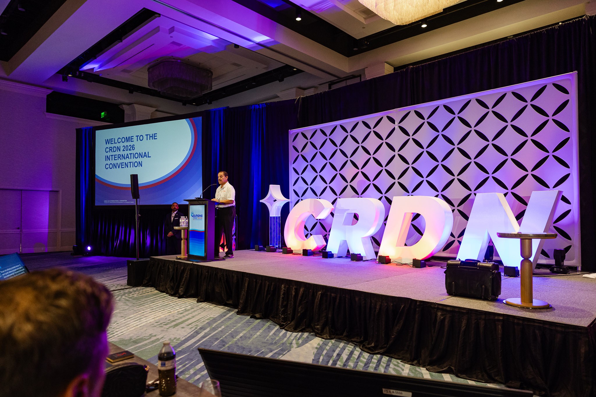 Speaker on stage at the CRDN conference in Bonita Springs, Florida